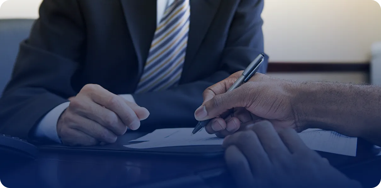 Business meeting with documents and pens.